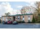Building exterior with parking and landscaping at 4754 Hedgemore Dr # S, Charlotte, NC 28209