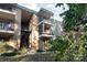 Two-story building with balconies and lush landscaping at 4754 Hedgemore Dr # S, Charlotte, NC 28209