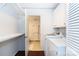 Convenient laundry room with washer, dryer, and bathroom access at 4754 Hedgemore Dr # S, Charlotte, NC 28209