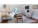 Light-filled living room with hardwood floors and comfortable seating at 4754 Hedgemore Dr # S, Charlotte, NC 28209