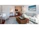 Bright living room with hardwood floors, comfy seating, and access to a patio at 4754 Hedgemore Dr # S, Charlotte, NC 28209