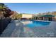 Community pool with brick patio and surrounding landscaping at 4754 Hedgemore Dr # S, Charlotte, NC 28209