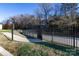 Private walkway with black metal fence alongside at 4754 Hedgemore Dr # S, Charlotte, NC 28209
