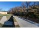 Concrete walkway next to a tranquil stream at 4754 Hedgemore Dr # S, Charlotte, NC 28209