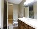 Bathroom with a single vanity with a wooden base and a doorway leading to another room at 1038 Rolling Park Ln, Fort Mill, SC 29715