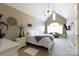 Bedroom featuring a vaulted ceiling, bright windows, a white bed and neutral tones at 1038 Rolling Park Ln, Fort Mill, SC 29715