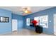 A Bonus Room with a white refrigerator and a bar, with tile flooring and light blue walls at 1038 Rolling Park Ln, Fort Mill, SC 29715