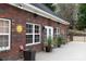 Brick guest house exterior, featuring multiple windows and a patio at 1038 Rolling Park Ln, Fort Mill, SC 29715