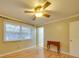 Well-lit bedroom with hardwood floors and ceiling fan at 106 Fox Run Dr, Fort Mill, SC 29715