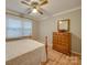 Bedroom with hardwood floors, dresser, and ceiling fan at 106 Fox Run Dr, Fort Mill, SC 29715