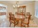 Formal dining room with hardwood floors, oval table, and china cabinet at 106 Fox Run Dr, Fort Mill, SC 29715