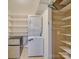 Laundry closet with washer, dryer, shelving and mini-fridge at 106 Fox Run Dr, Fort Mill, SC 29715