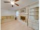 Living room with light walls, a fireplace, and built-in shelving at 106 Fox Run Dr, Fort Mill, SC 29715