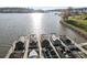 View of a boat dock filled with covered boats, offering convenient access to the water at 112 Sisters Cove Ct, Mooresville, NC 28117