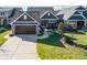 Two-car garage and driveway leading to a charming house at 112 Sisters Cove Ct, Mooresville, NC 28117