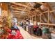 Unfinished attic space with exposed beams and an assortment of stored boxes and items at 112 Sisters Cove Ct, Mooresville, NC 28117