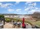 Beautiful backyard with waterfront view, patio, and string lights at 112 Sisters Cove Ct, Mooresville, NC 28117