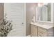 Bathroom featuring a white vanity with marble countertops, a towel rack, and a white door at 112 Sisters Cove Ct, Mooresville, NC 28117