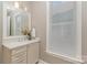 Bathroom featuring a white vanity with marble countertops and a window at 112 Sisters Cove Ct, Mooresville, NC 28117