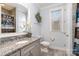 Bright bathroom with granite countertops, gray vanity, and decorative accents for a serene and stylish space at 112 Sisters Cove Ct, Mooresville, NC 28117