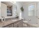 Bathroom with granite countertop and gray cabinets at 112 Sisters Cove Ct, Mooresville, NC 28117