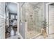 Bathroom with a modern glass enclosed shower, tile walls and floors at 112 Sisters Cove Ct, Mooresville, NC 28117