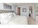 Spacious bedroom with a queen-size bed and walk-in closet at 112 Sisters Cove Ct, Mooresville, NC 28117