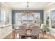 Elegant dining room with lake views and chandelier at 112 Sisters Cove Ct, Mooresville, NC 28117