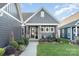 Gray house with front porch and landscaping at 112 Sisters Cove Ct, Mooresville, NC 28117