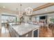 Spacious kitchen boasts granite island, modern appliances, and open floor plan at 112 Sisters Cove Ct, Mooresville, NC 28117