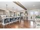 Open concept kitchen with a large granite island, seating and stainless steel appliances at 112 Sisters Cove Ct, Mooresville, NC 28117