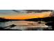 Beautiful sunset view over the lake with docks and calm water at 112 Sisters Cove Ct, Mooresville, NC 28117