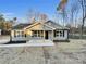 Newly built gray house with a front porch at 1308 Carmel Rd, Lancaster, SC 29720