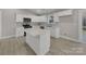 Modern kitchen featuring white cabinets, quartz countertops, and stainless steel appliances at 1308 Carmel Rd, Lancaster, SC 29720