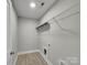 Functional laundry room with wire shelving and vinyl flooring at 1308 Carmel Rd, Lancaster, SC 29720