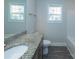 Well-lit bathroom with granite countertop and updated fixtures at 267 Elm Nw Ave, Concord, NC 28025