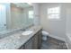 Bathroom boasts granite vanity, a bathtub, and updated fixtures at 267 Elm Nw Ave, Concord, NC 28025