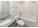 Clean bathroom with granite vanity and a shower/tub combo at 267 Elm Nw Ave, Concord, NC 28025