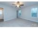 Bright bedroom with neutral walls and ceiling fan at 267 Elm Nw Ave, Concord, NC 28025