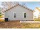 Gray house back with two windows and a patio at 267 Elm Nw Ave, Concord, NC 28025