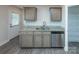 Modern kitchen featuring granite countertops, stainless steel appliances, and ample cabinet space at 267 Elm Nw Ave, Concord, NC 28025