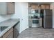 Stainless steel appliances and granite countertops in this kitchen at 267 Elm Nw Ave, Concord, NC 28025