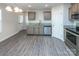 Modern kitchen with gray cabinets and stainless steel appliances at 267 Elm Nw Ave, Concord, NC 28025