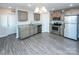 Gray cabinets, granite countertops, and stainless steel appliances in this kitchen at 267 Elm Nw Ave, Concord, NC 28025