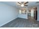 Open living room with kitchen view and ceiling fan at 267 Elm Nw Ave, Concord, NC 28025