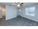 Bright living room with vinyl plank flooring and ceiling fan at 267 Elm Nw Ave, Concord, NC 28025