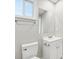 Bathroom showcasing a white vanity with a sink, toilet, and a large mirror at 287 Young Sw Ave, Concord, NC 28025