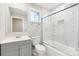 This renovated bathroom offers an updated vanity and tub with custom marble-look tile at 287 Young Sw Ave, Concord, NC 28025