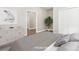 Bedroom featuring hardwood floors, a plant, closet, and neutral paint, perfect for relaxation at 287 Young Sw Ave, Concord, NC 28025