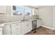 Bright kitchen with white cabinets, subway tile backsplash, and stainless steel appliances at 287 Young Sw Ave, Concord, NC 28025